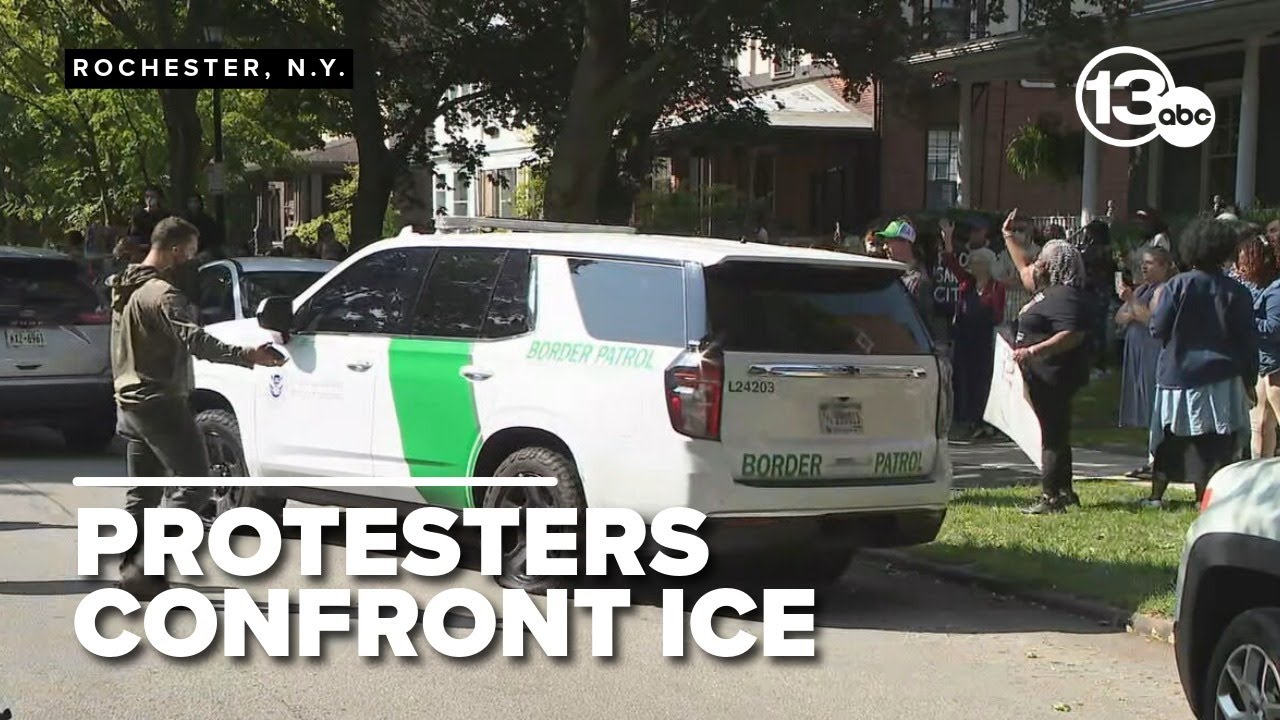 Crowd jeers as Border Patrol vehicle with flattened tires leaves neighborhood