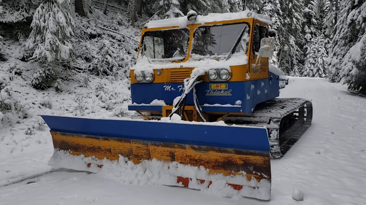 Snowcat plowing the road