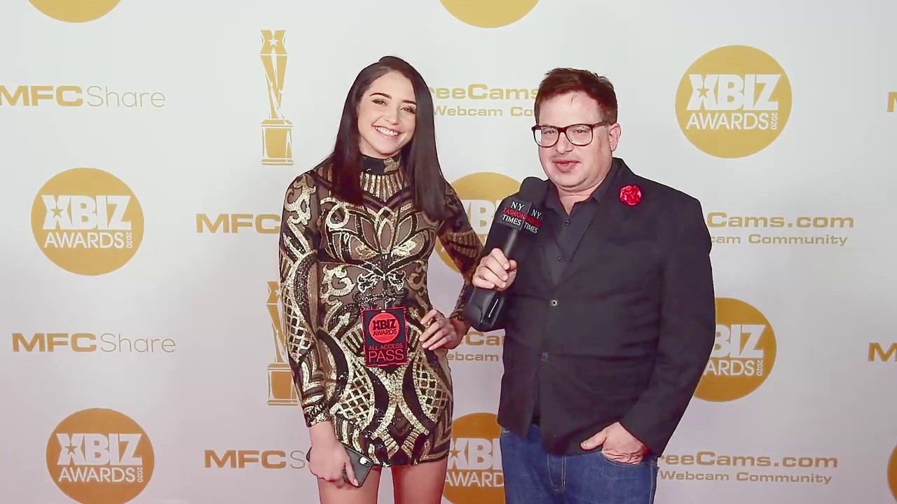 Avi Love wears tight dress on red carpet at the Xbiz Awards in Los Angeles, CA.